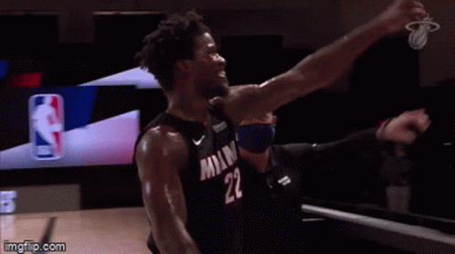 A Basketball Player With The Number 22 On His Jersey Is Celebrating . GIF