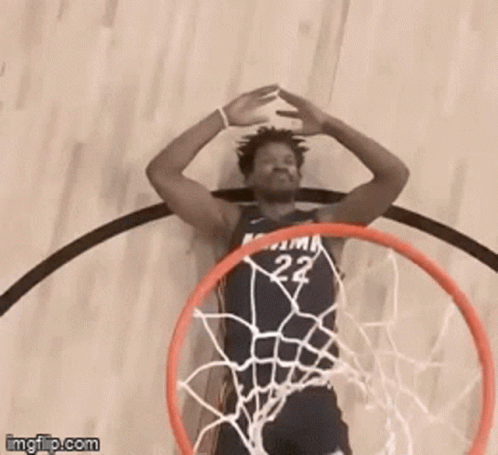 A Basketball Player With The Number 22 On His Jersey Is Going Through A Hoop GIF