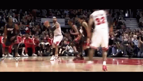 A Basketball Player With The Number 22 On His Jersey Is Jumping In The Air GIF