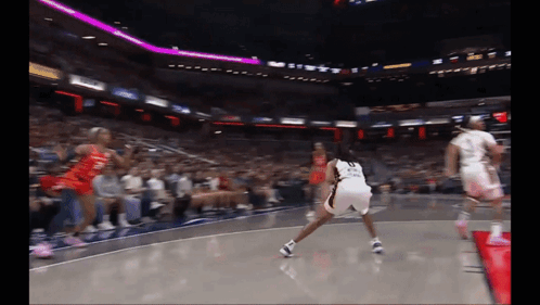 A Basketball Player With The Number 23 On Her Shorts Is Dribbling The Ball GIF