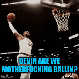 a basketball player with the number 23 on his jersey is dunking the ball