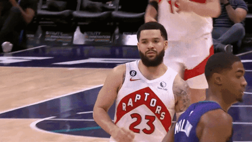 A Basketball Player With The Number 23 On His Jersey Stands On The Court GIF