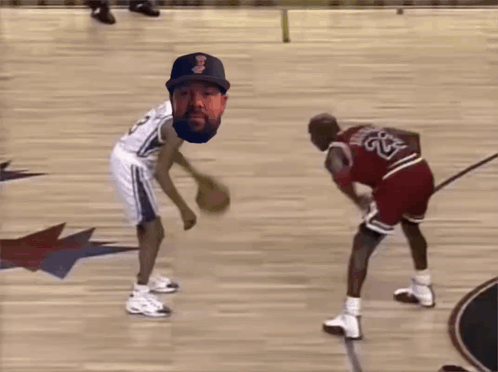 A Basketball Player With The Number 23 On His Jersey Tries To Block Another Player GIF