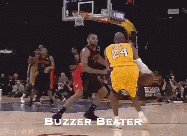 A Basketball Player With The Number 24 On His Jersey Is Being Blocked By Another Player GIF
