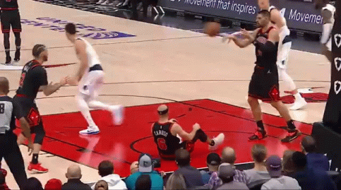 A Basketball Player With The Number 26 On His Jersey Is Laying On The Floor GIF