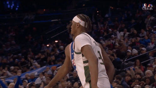 A Basketball Player With The Number 3 On His Back GIF
