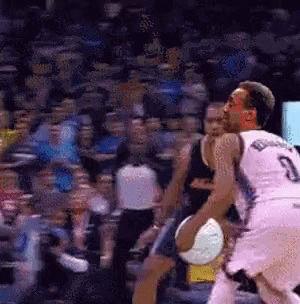a basketball player with the number 3 on his jersey is dribbling a basketball