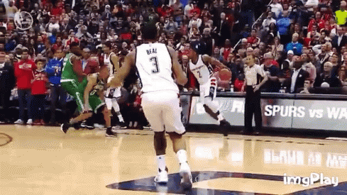A Basketball Player With The Number 3 On His Jersey Is Jumping In The Air GIF