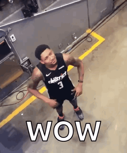 A Basketball Player With The Number 3 On His Jersey Is Standing In A Parking Lot GIF