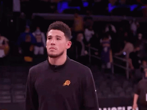 A Basketball Player With The Number 3 On His Jersey Walks On The Court GIF