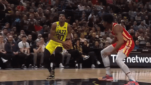 A Basketball Player With The Number 30 On His Jersey Dribbles The Ball GIF