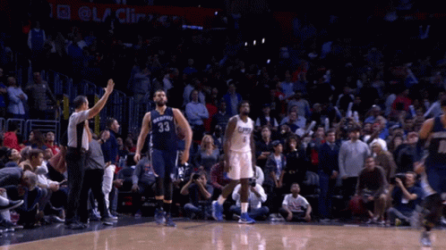 A Basketball Player With The Number 33 On His Jersey Is Running On The Court GIF