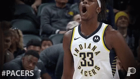 A Basketball Player With The Number 33 On His Jersey Is Screaming GIF