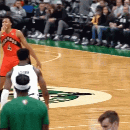 A Basketball Player With The Number 4 On His Jersey Stands On The Court GIF