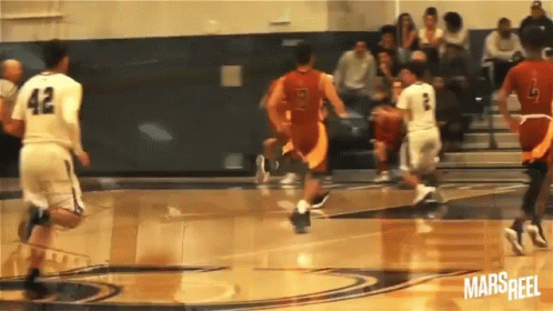 A Basketball Player With The Number 42 On His Jersey Is Dribbling The Ball GIF