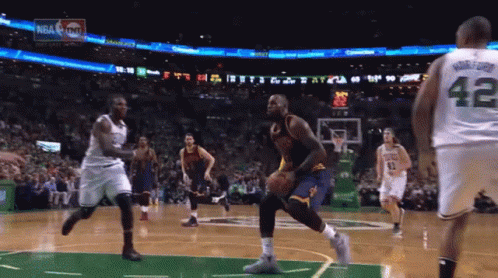 A Basketball Player With The Number 42 On His Jersey Is Dribbling The Ball GIF