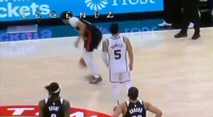 A Basketball Player With The Number 5 On His Back Is Falling On The Court GIF