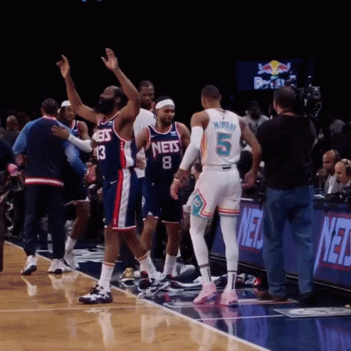 A Basketball Player With The Number 5 On His Back Stands On The Court GIF