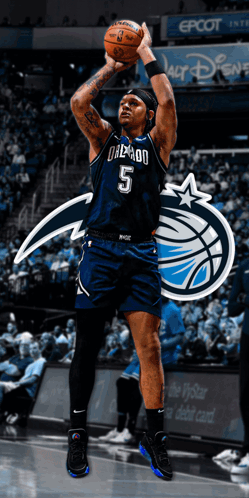 A Basketball Player With The Number 5 On His Jersey Holds A Basketball GIF