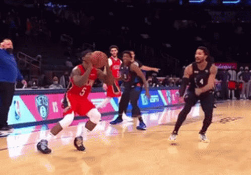A Basketball Player With The Number 5 On His Jersey Is Dribbling A Ball GIF