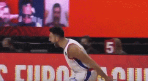 A Basketball Player With The Number 5 On His Jersey Is Jumping GIF