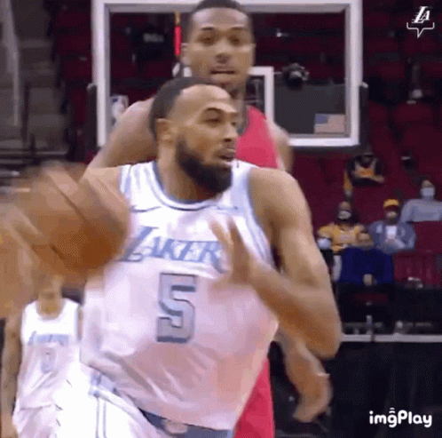 A Basketball Player With The Number 5 On His Jersey Is Running On The Court GIF