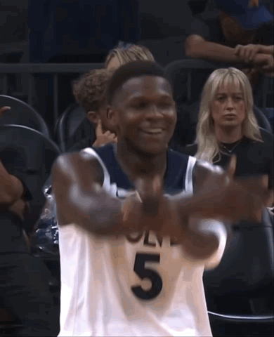 A Basketball Player With The Number 5 On His Jersey Is Smiling GIF