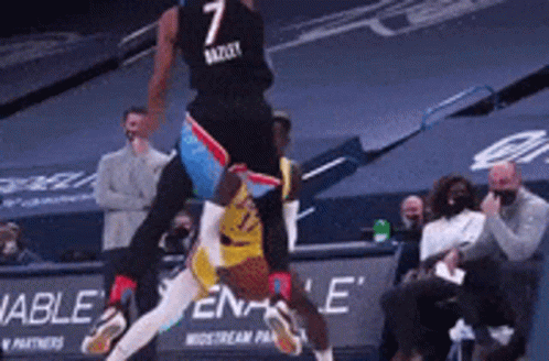 A Basketball Player With The Number 7 On His Jersey Is Jumping In The Air GIF