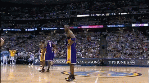 a basketball player with the number 7 on his jersey stands on a court
