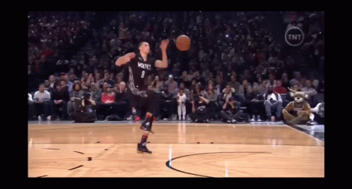 A Basketball Player With The Number 7 On His Jersey Throws The Ball GIF