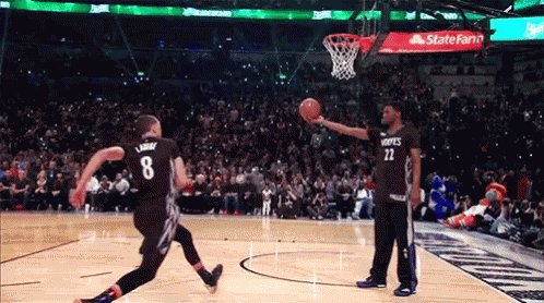 A Basketball Player With The Number 8 On His Jersey Is Jumping In The Air GIF