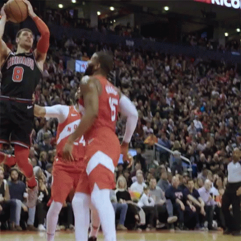 A Basketball Player With The Number 8 On His Jersey Is Jumping To Catch The Ball GIF