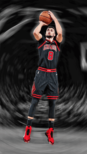 A Basketball Player With The Number 8 On His Jersey Is Shooting A Ball GIF