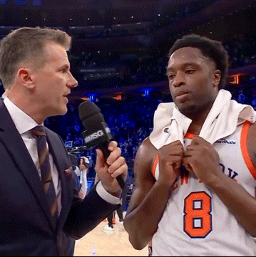 A Basketball Player With The Number 8 On His Jersey Talks To A Reporter GIF