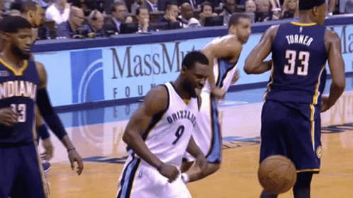 A Basketball Player With The Number 9 On His Jersey Is Running On The Court GIF
