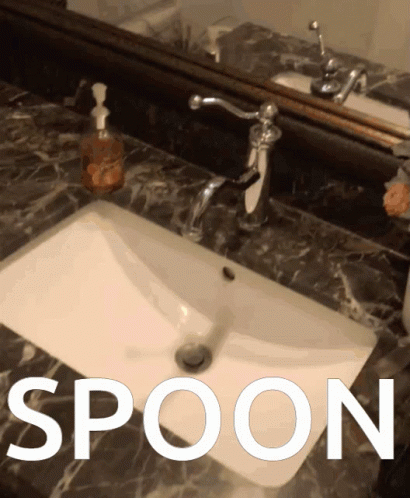 A Bathroom Sink With The Word Spoon Written Above It GIF