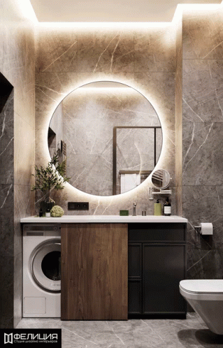 A Bathroom With A Round Mirror And A Washer GIF