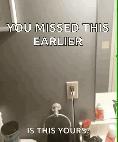 A Bathroom With A Sign That Says You Missed This Earlier GIF