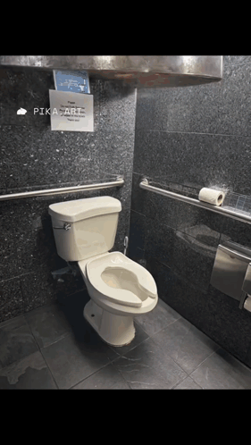 a bathroom with a toilet and a sign that says pika art on it