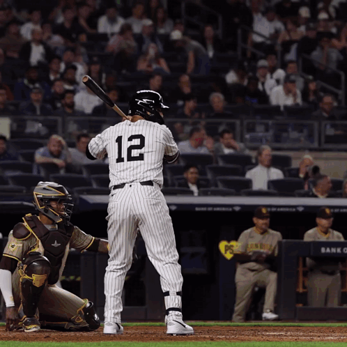 A Batter With The Number 12 On The Back Of His Jersey GIF