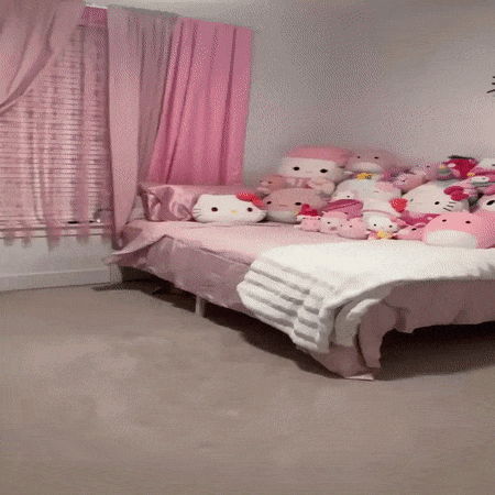 A Bed In A Room With Hello Kitty Stuffed Animals GIF