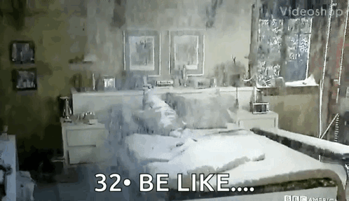 A Bedroom With A Bed , Nightstands , And A Window With The Words 32 Be Like GIF