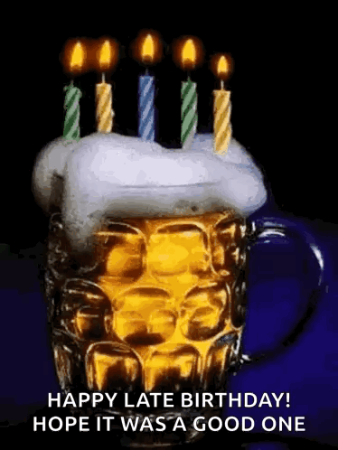 A Beer Mug With Candles On Top Of It . GIF