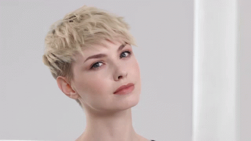 A Before And After Photo Of A Woman With A Textured Pixie Hairstyle GIF