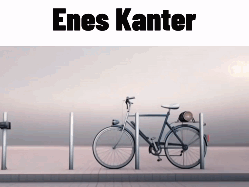 A Bicycle Is Parked In Front Of A Sign That Says Enes Kanter On It GIF