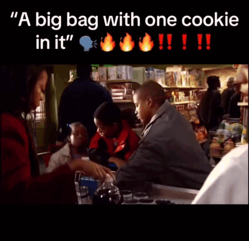 A Big Bag With One Cookie In It Is Being Held By A Man GIF