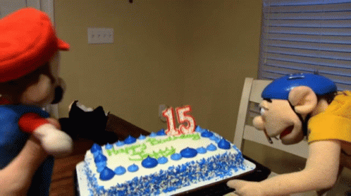 A Birthday Cake With A Candle That Says 15 GIF