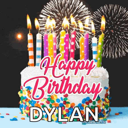 A Birthday Cake With Candles And Fireworks In The Background For Dylan . GIF