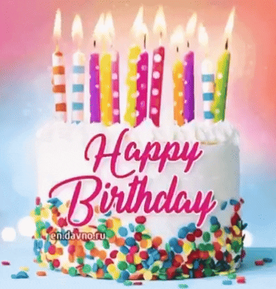 A Birthday Cake With Candles And Sprinkles On It . GIF