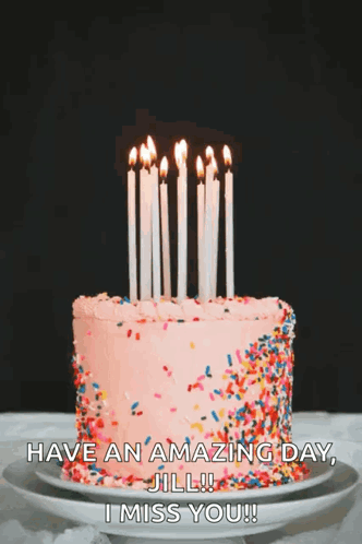 a birthday cake with candles and sprinkles on it and the words have an amazing day jill i miss you